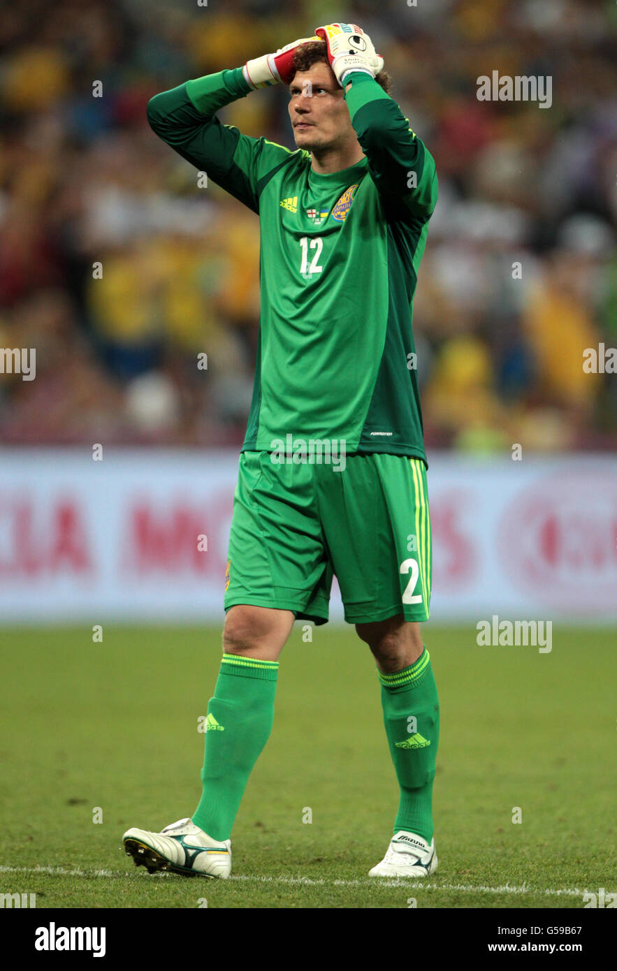 Ukraine goalkeeper Andriy Pyatov shows his dejection after an error that leads to England's Wayne Rooney scoring the winning goal Stock Photo