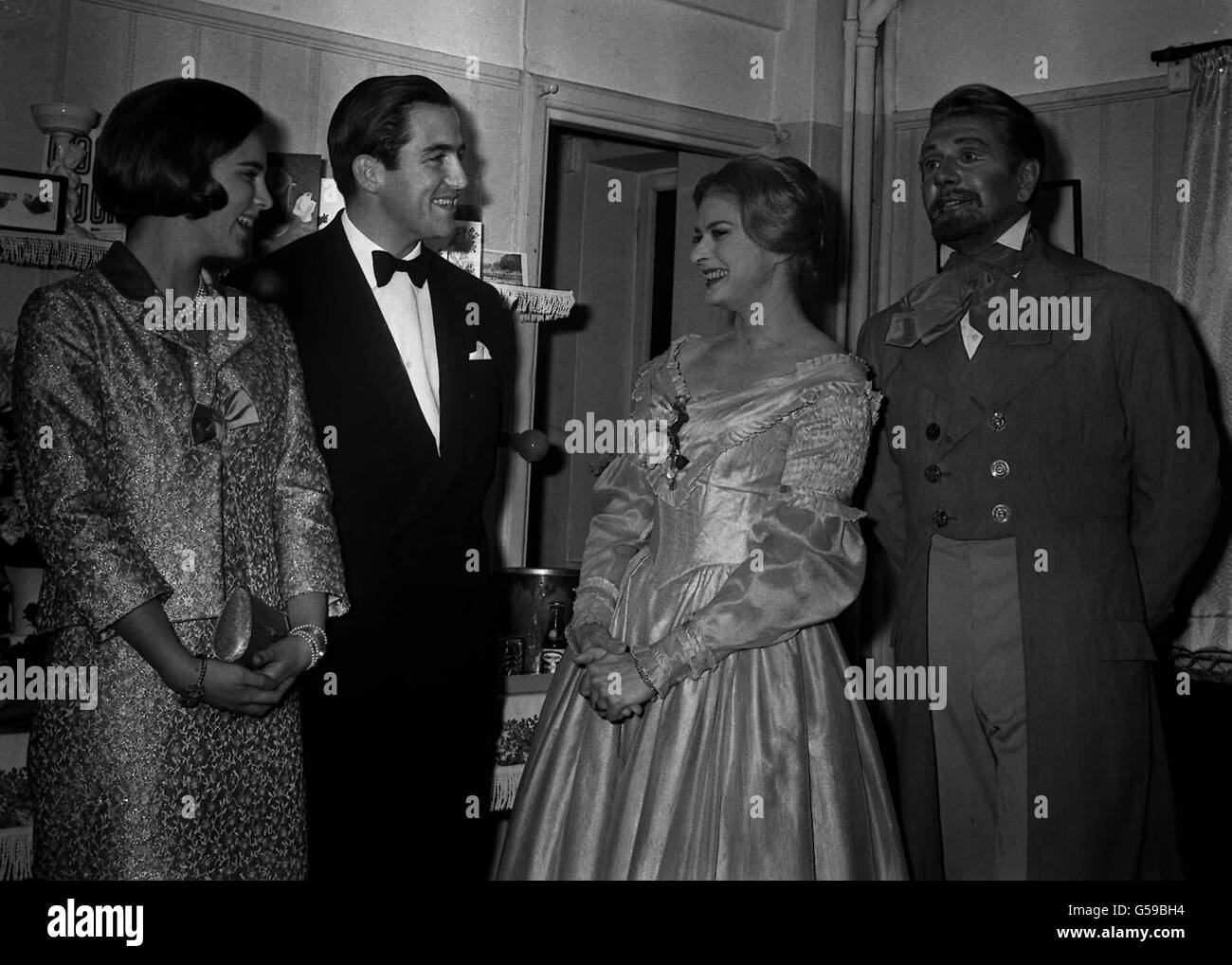 1965: King Constantine of Greece and Queen Anne-Marie (left) talk with the stars of the show, Ingrid Bergman and Sir Michael Redgrave, in Miss Bergman's dressing room after seeing the play 'A month in the Country' at the Cambridge Theatre, London. Stock Photo