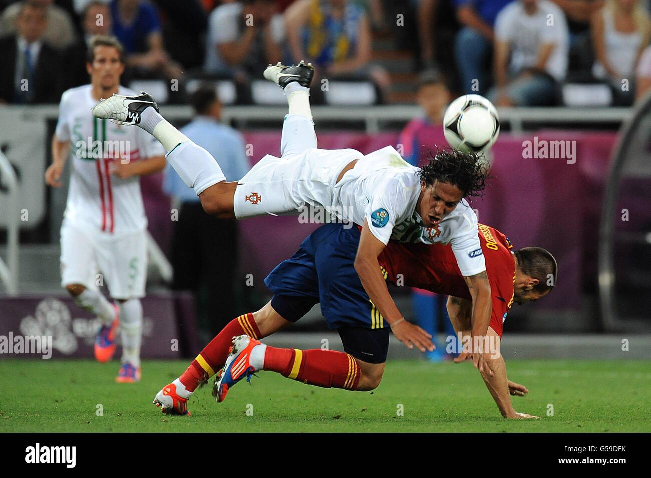 Soccer - UEFA Euro 2012 - Semi Final - Portugal v Spain - Donbass Arena. Spain's Alvaro Negredo (right) and Portugal's Eduardo Bruno Alves battle for the ball Stock Photo