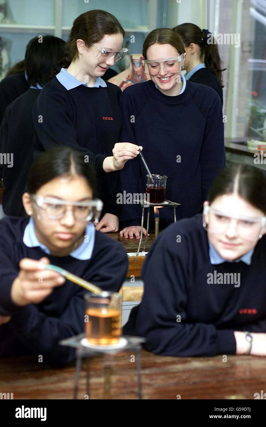 Pupils Jessica Neal (rear left) and Jane Macallan (right) during a science lesson at Colchester County High School For Girls, which has been singled out by Ofsted inspectors as being outstanding and improving. * ...and was among dozens of schools praised by Chief Inspector of Schools Mike Tomlinson in his annual report. School standards minister Estelle Morris welcomed the report covering the 1999-2000 school year saying it showed teaching and results were improving at many schools in England. Stock Photo