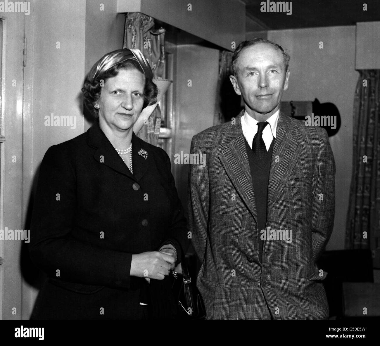 1956: The Earl of Home (Sir Alec Douglas-Home), Secretary of State for Commonwealth Relations, pictured with his wife at London Airport as they were about to board a BOAC liner for Canada at the invitation of the Canadian government. Stock Photo