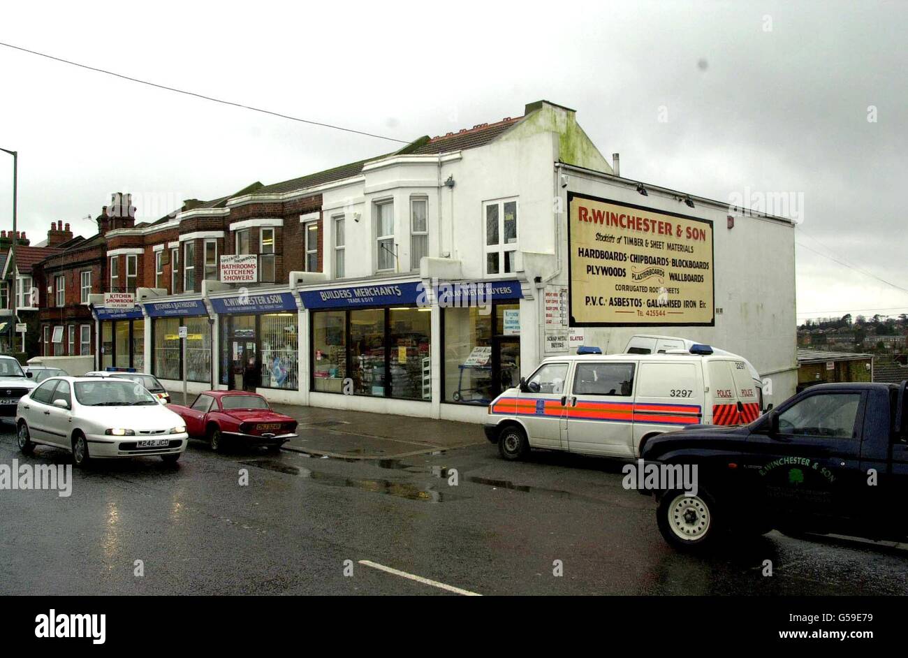 A police vehicle outside a builders merchants in Old London Road in Ore, Hastings, East Sussex, close to where detectives from the Metropolitan Police, investigating the Brink's-Mat bullion robbery, are digging. * The robbery of gold bullion and jewels worth 26 million from the Brink's-Mat vaults at London's Heathrow Airport at 6.30am on November 26, 1983, was Britain's biggest. Stock Photo