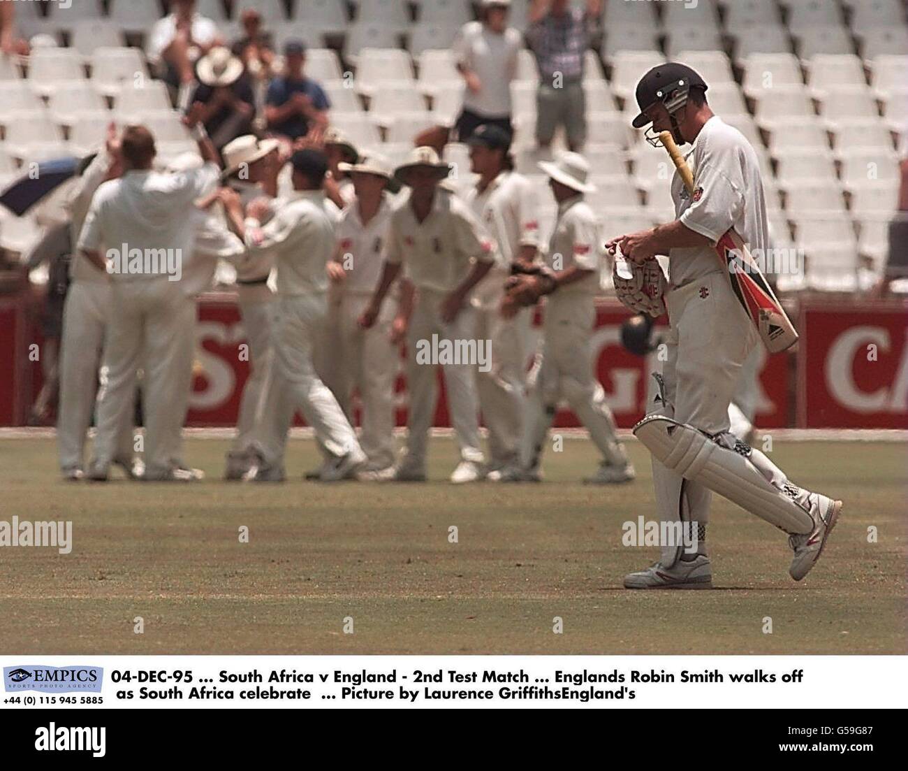 04-DEC-95. South Africa v England - 2nd Test Match. Englands Robin Smith walks off as South Africa celebrate. Picture by Laurence GriffithsEngland's Stock Photo