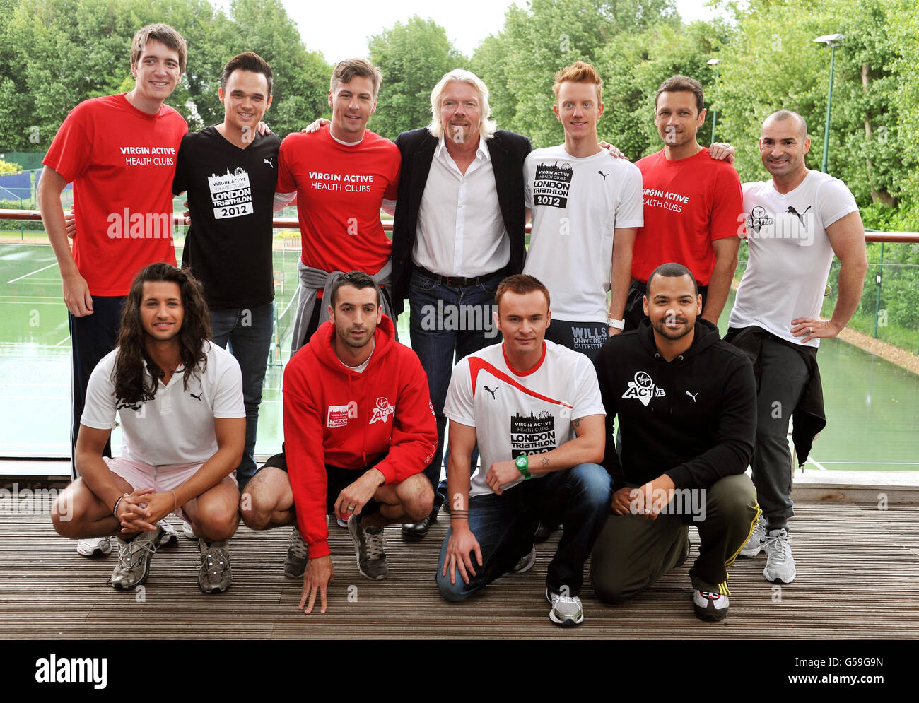 Sir Richard Branson (top row centre) at the Virgin Active health club in Chiswick south west London, with (top row left to right) Oliver Phelps, Gareth Gates, Jon Lee, James Barr, Mark Ramprakash, and Louie Spence (bottom row left to right) and Ollie Locke, Toby Anstis, Matt Evers and Michael Underwood who will all take part in the Virgin Active London Triathlon on 22nd-23rd September. Stock Photo