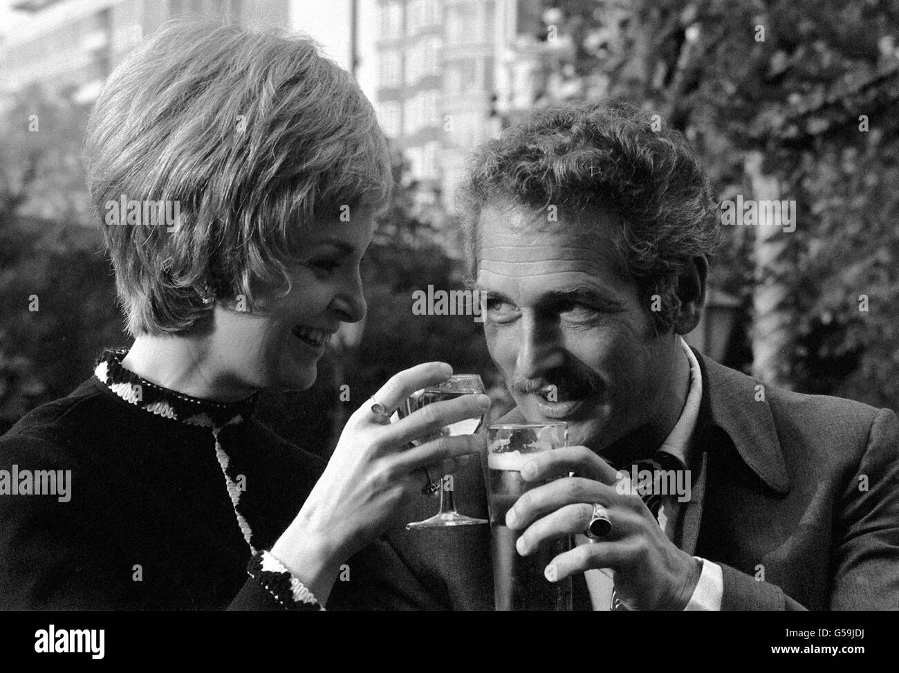 Hollywood celebrity couple, actor Paul Newman and his wife Joanne Woodward, enjoying a holiday in England at Les Ambassadeurs, in London. Stock Photo