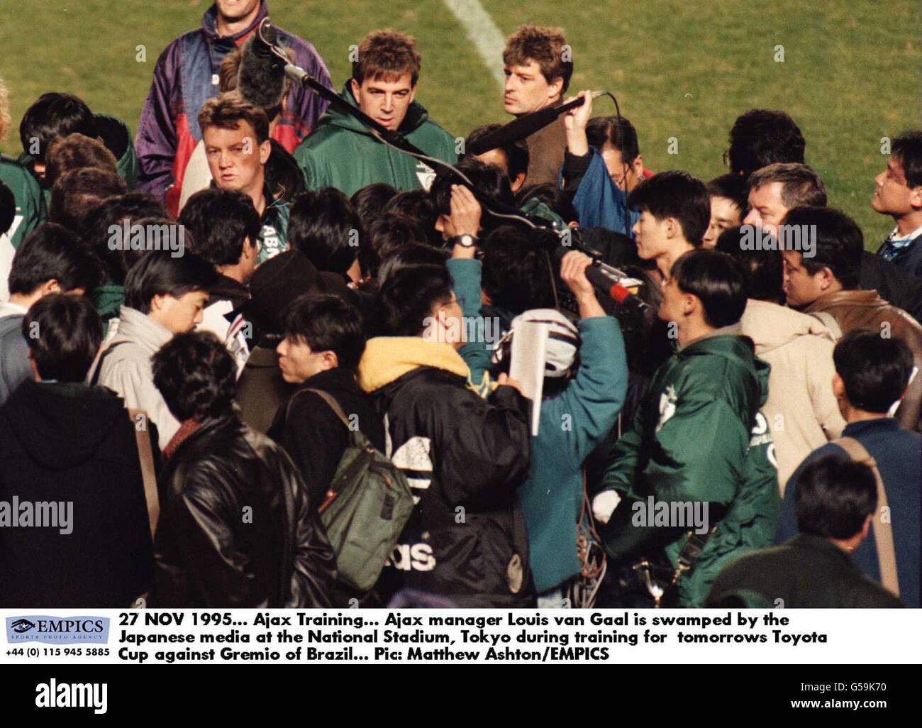 Ajax manager Louis van Gaal is swamped by the Japanese media at the National Stadium, Tokyo during training for tomorrows Toyota Cup Tokyo Stock Photo
