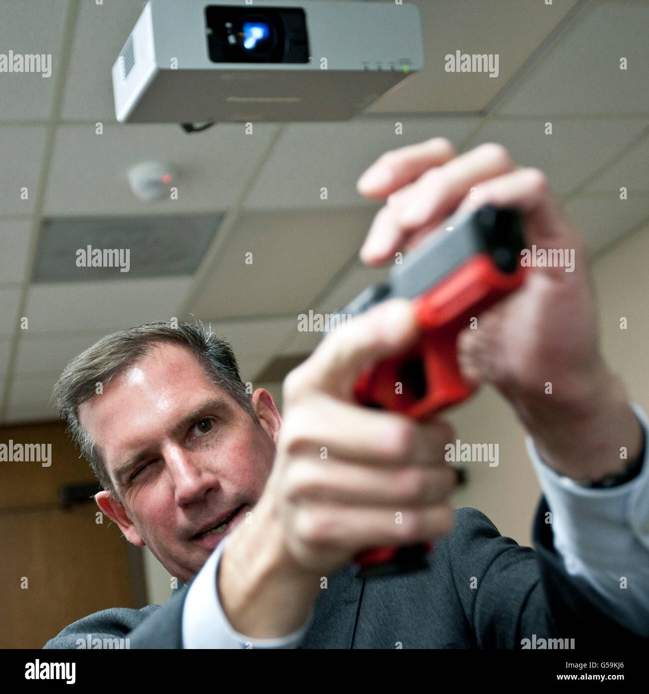 Supervisory Special Agent Richard Schott demonstrates gun use at the