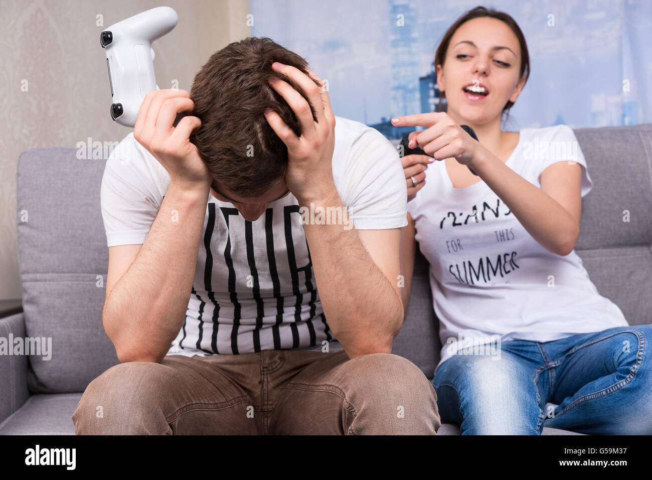 Premium Photo  Boyfriend cheering her beautiul girlfriend while she's playing  online games using wireless controller. room with neon light.