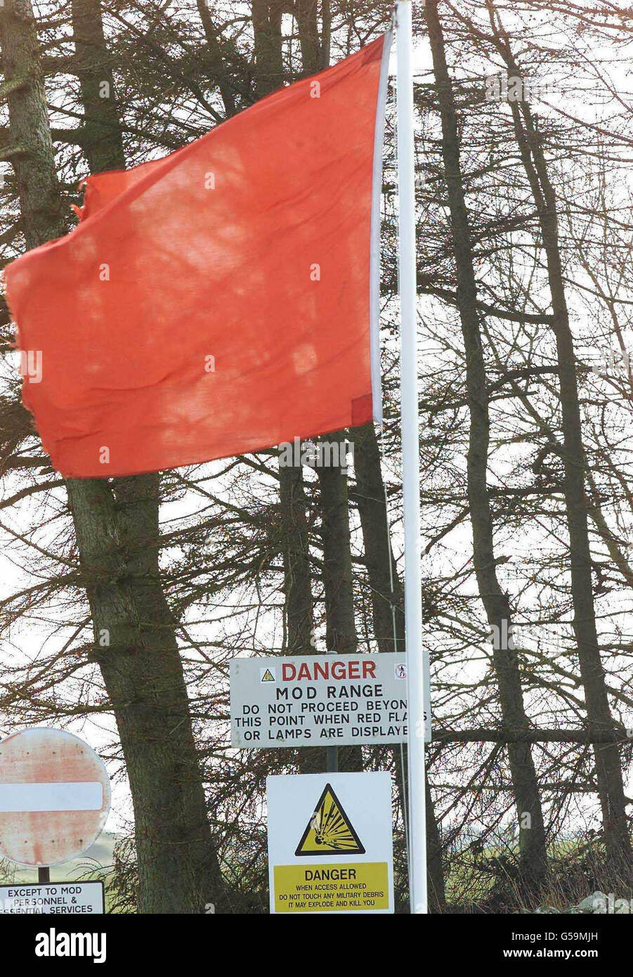 A red flag signifies the resumption of testing of depleted uranium shells at the military firing range in Dundrennan, near Kirkcudbright on the Solway Firth in south-west Scotland, for the first time since fears arose over alleged links to cancer. * A number of servicemen have claimed they became seriously ill with Balkan War syndrome' after being exposed to depleted uranium. 'Today's testing is routine and poses no health hazard', an MoD spokeswoman said. Stock Photo