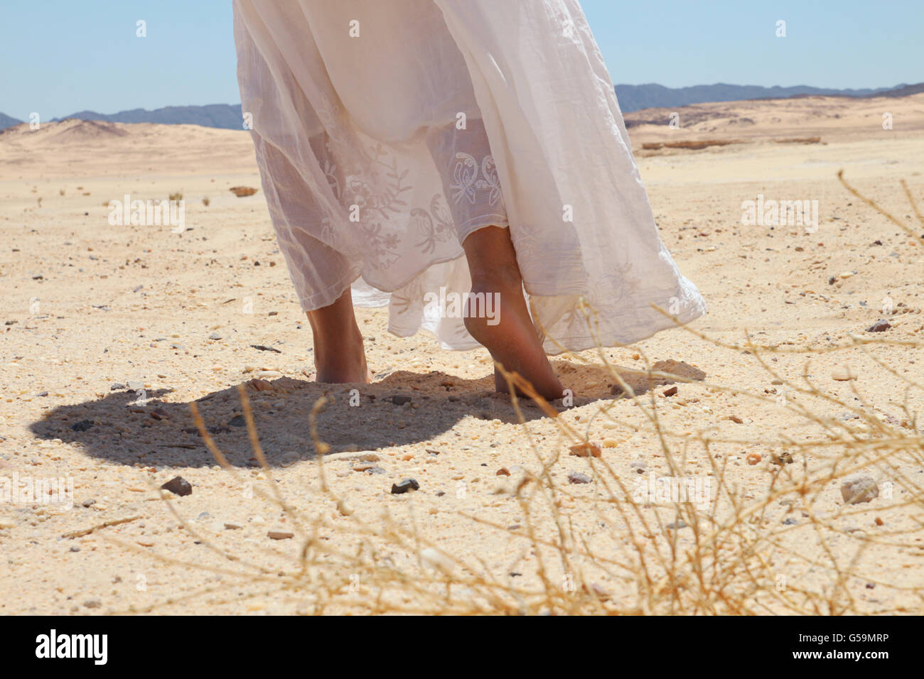 Walking in desert woman's feet Stock Photo Alamy