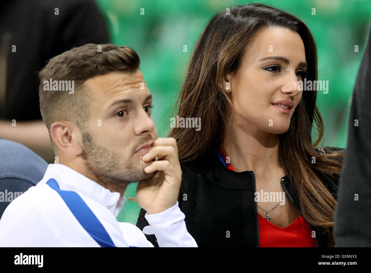 England's Jack Wilshere with his fiancee Adriana Michael during the UEFA Euro 2016, Group B match at the Stade Geoffroy Guichard, Saint-Etienne. Stock Photo