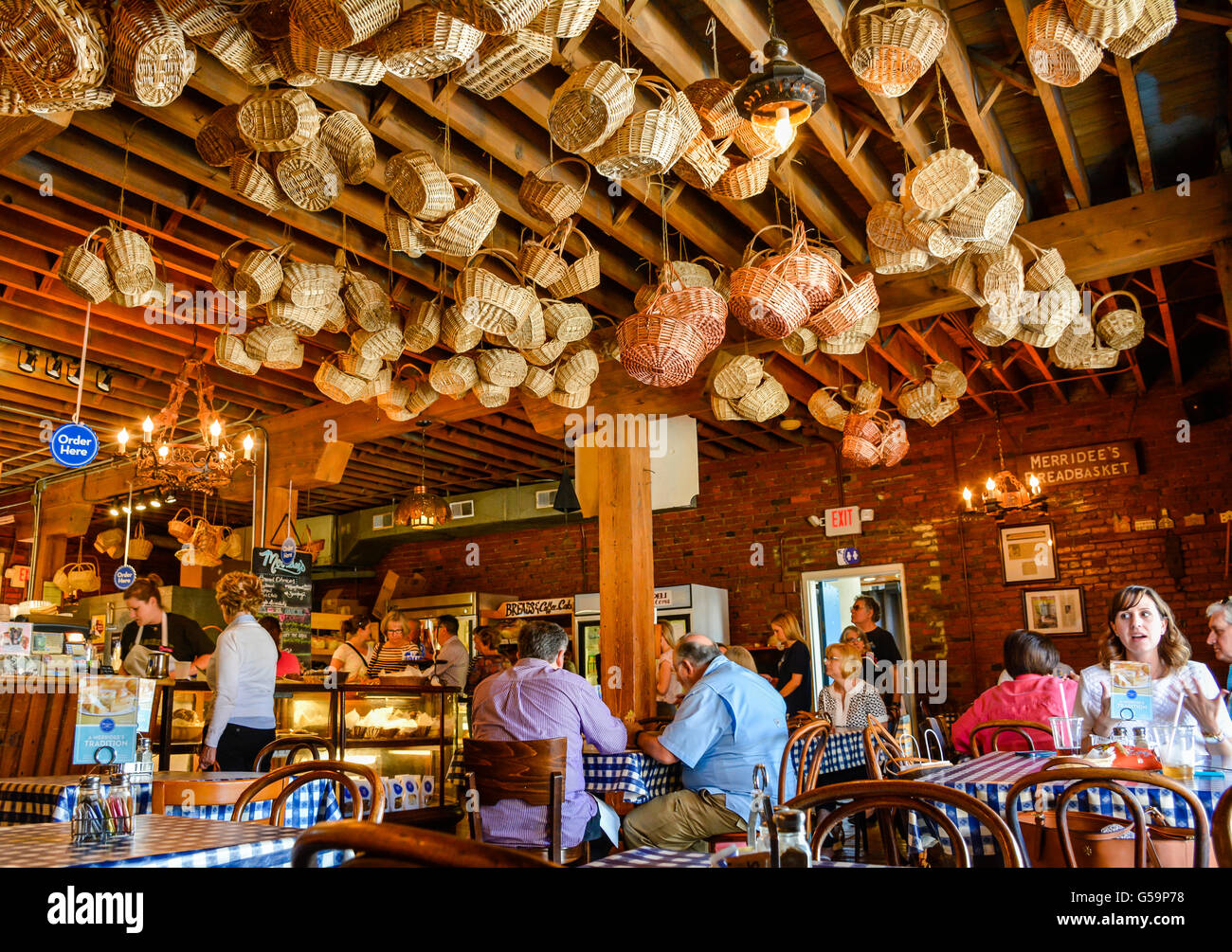 People In Decorative Interior Of Hanging Baskets From The