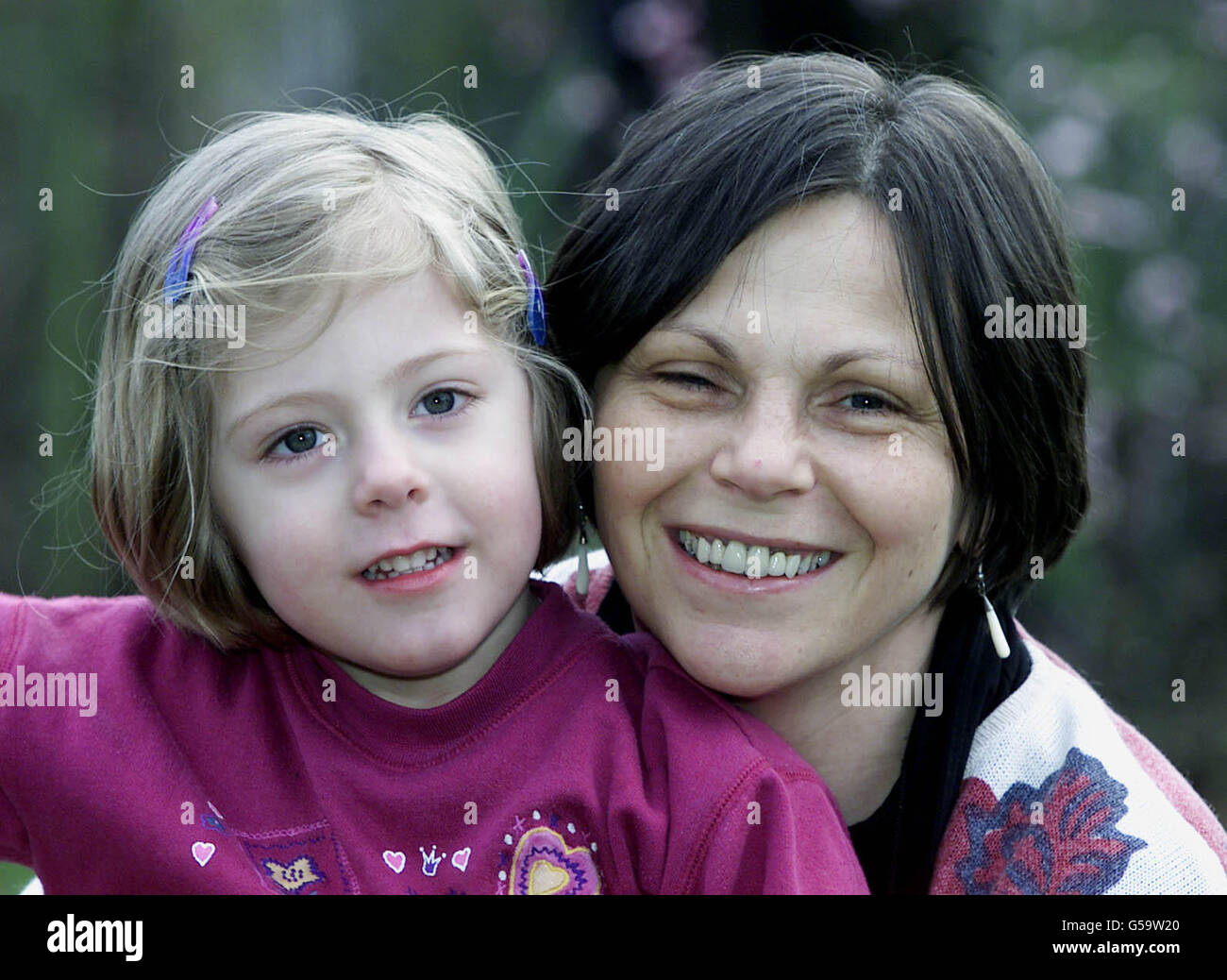 Jenny Stacey (right) and her daughter, Lucy Young, who alerted neighbours after her mother, a diabetic, collapsed upstairs in her home at Bury St Edmunds, Suffolk. The little girl flagged down a passing neighbour who promptly called an ambulance. * Paramedics arrived to find Jennny collapsed on the floor with very low blood sugar levels and administered glucose, after which she came around. Lucy was presented with a certificate by the East Anglian Ambulance Service and a junior paramedic handbook, giving practical advice on first aid. Stock Photo