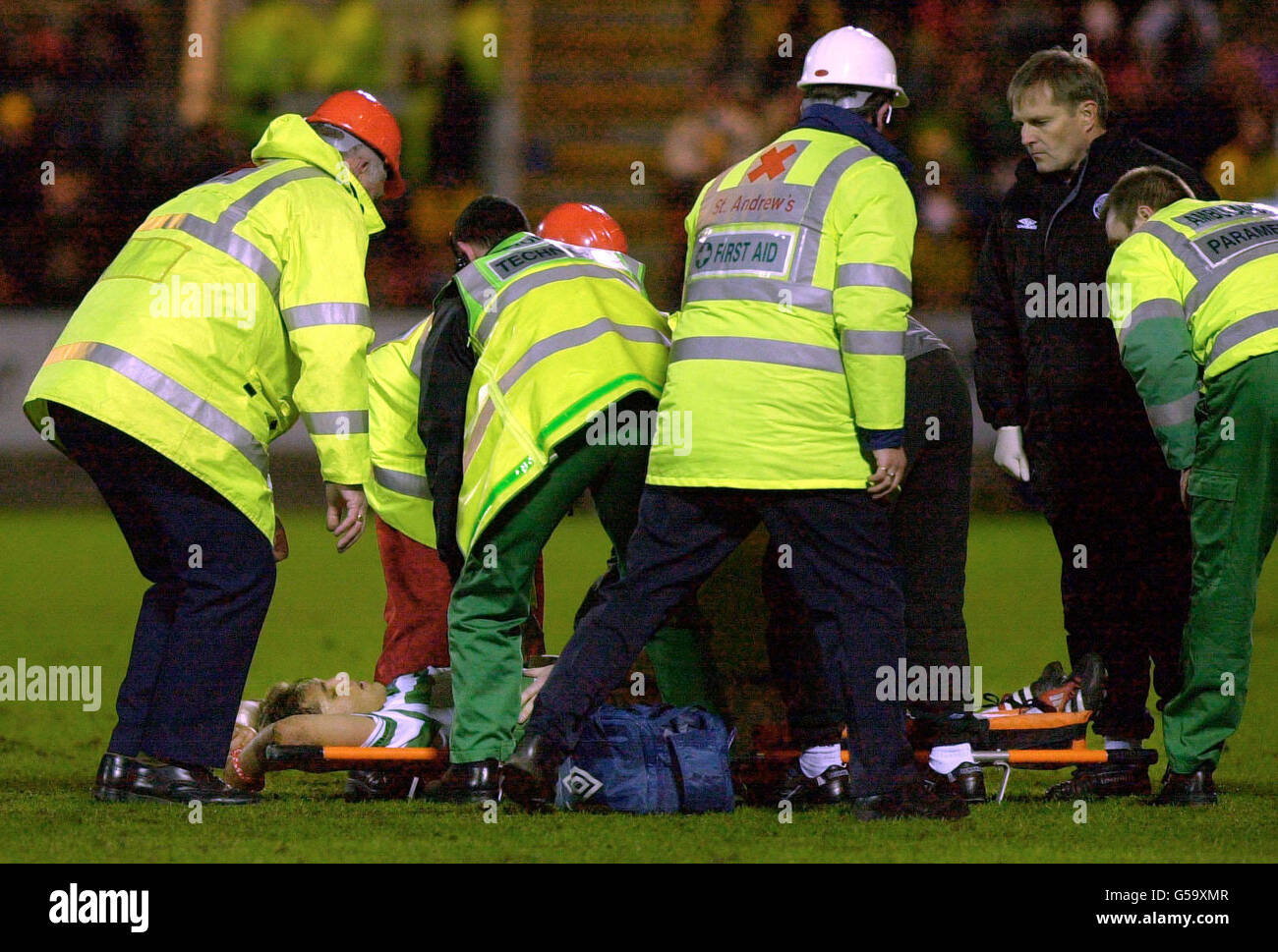 Celtic's Stilian Petrov is stretchered off the pitch after a tackle, during their Scottish Premier League football match against St Johnstone at Perth's McDiarmid Park stadium. Stock Photo