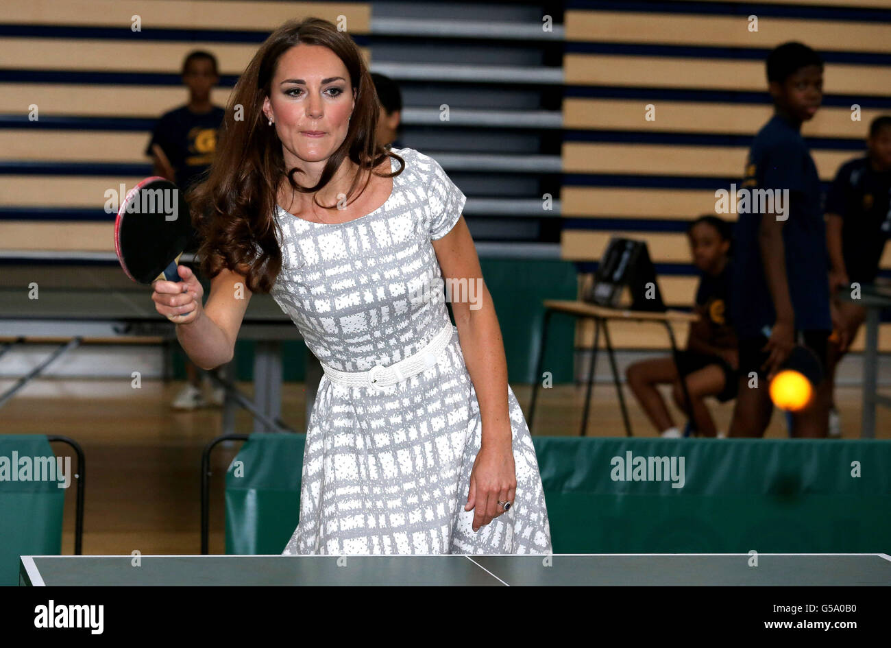 The Duchess of Cambridge plays table tennis during a visit to Bacon's
