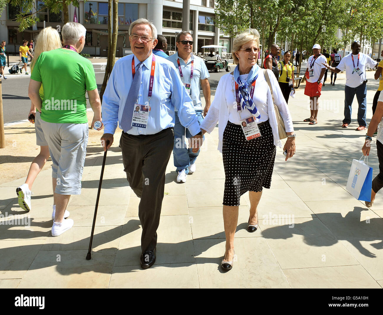 King Constantine of Greece with his wife Queen Anne Marie stroll hand in hand through the Athletes Village at the London 2012 Olympic Games site in Stratford, east London. Stock Photo