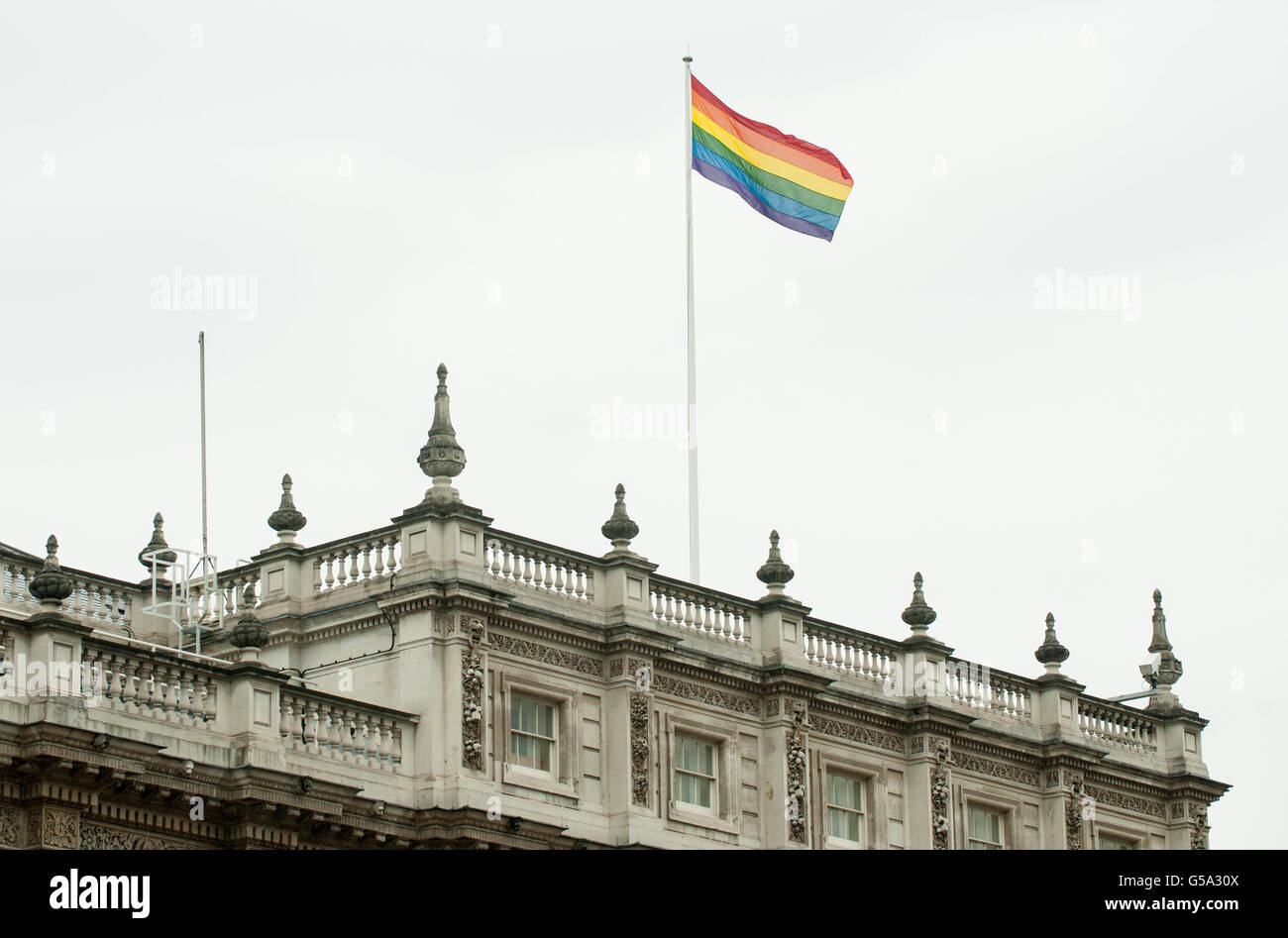 General view of a rainbow flag flying from the roof of the Cabinet Office, in Westminster, central London. Stock Photo