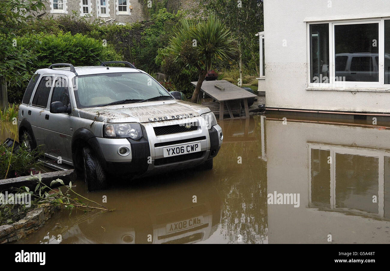 Flood water outside a property near Yealmpton on the River Yealm, after heavy rainfall. Stock Photo
