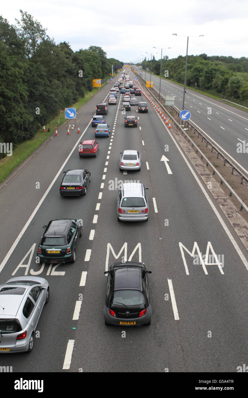 Three lanes of traffic filter into one on the M4 motorway which has