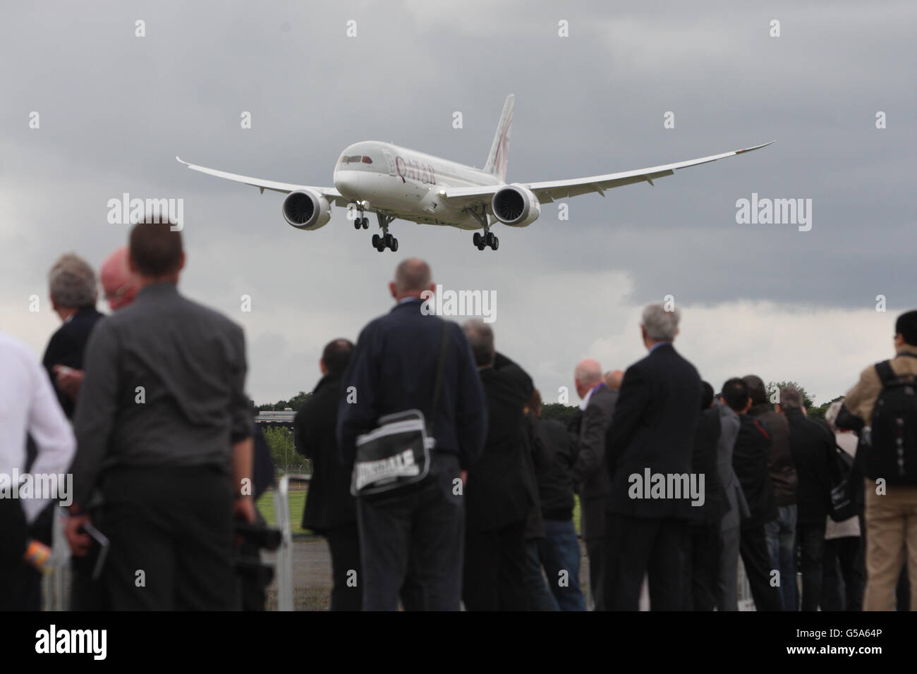 The Qatar Airways Boeing 787 Dreamliner performs a flypast at the Farnborough International Airshow in Hampshire. Stock Photo