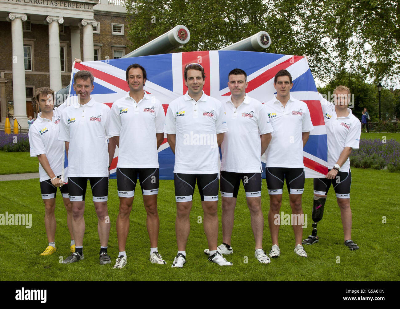 Television adventurer Mark Beaumont (centre) reveals the cycle team - (from left to right) wounded soldier Rupert 'Rab' Smedley, Simon Oldfield, wounded soldier Mike Westwell, wounded soldier Don Maclean, Peter Latham and wounded soldier Craig Preece - who he will be leading during the Trois Etapes cycle race in France to raise funds for Walking With The Wounded, at the Imperial War Museum in London. Stock Photo