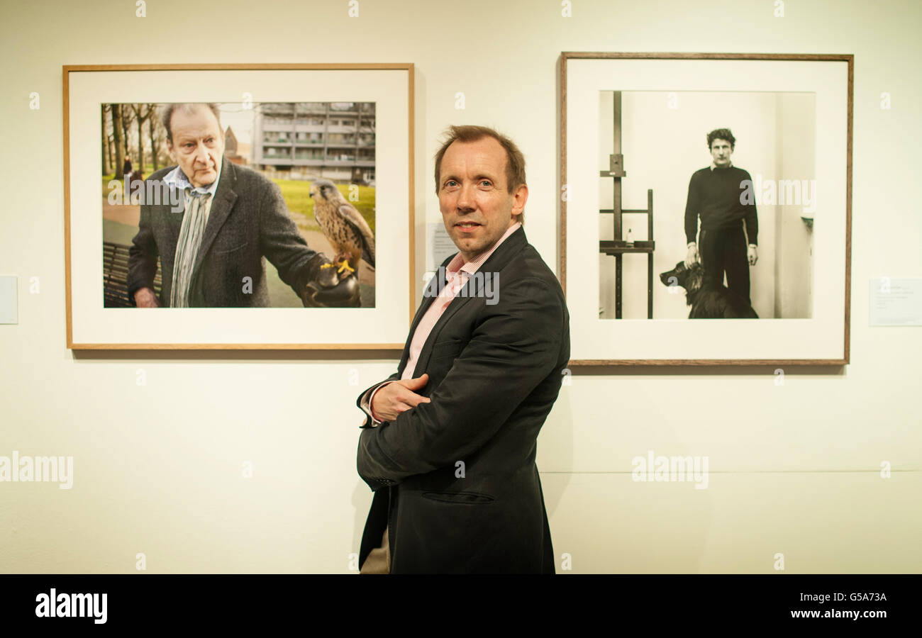 Photographer David Dawson poses with works from 'An Artist's Life: Photographs of Lucian Freud by Cecil Beaton and David Dawson', which is on display at Sotheby's, in London, from 10 July to 11 August 2012. Stock Photo