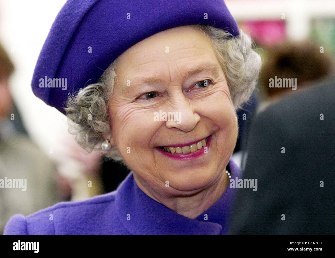 Queen Elizabeth II during a tour of a porcelain factory in Worcester