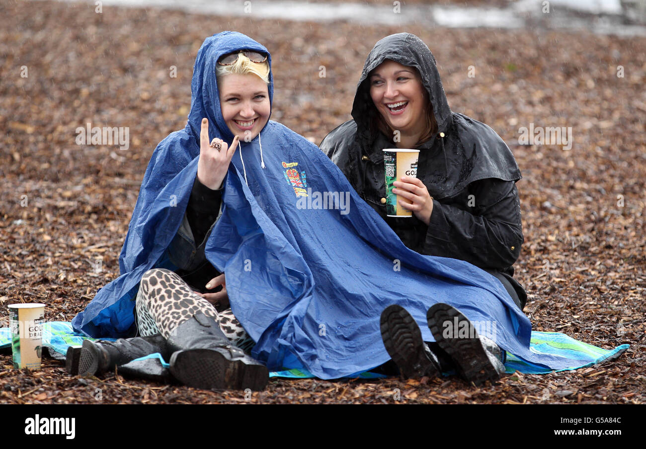 Festival goers brave the rain at the Hard Rock Calling music festival in Hyde Park, London. Stock Photo