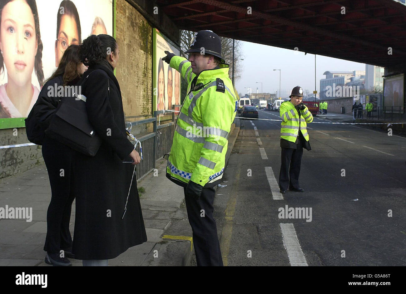 Police directing commuters away from the security cordon around the ...