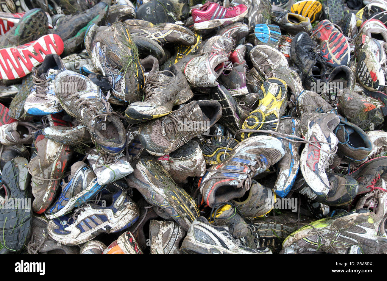 Abandoned trainers left after the 2012 Tough Mudder Extreme Endurance Challenge held in the grounds of Drumlanrig Castle and Country Estate in Dumfriesshire. Stock Photo