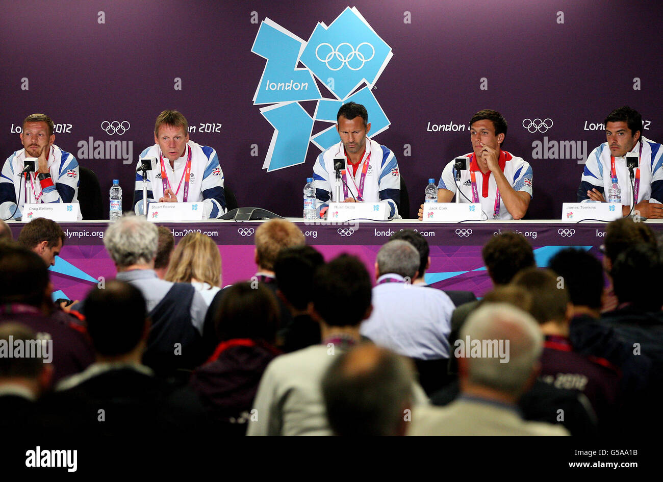 England's (left-right) Craig Bellamy, coach Stuart Pearce, captain Ryan Giggs, Jack Cork and James Tomkins during a press conference at the Olympic Park, London. Stock Photo
