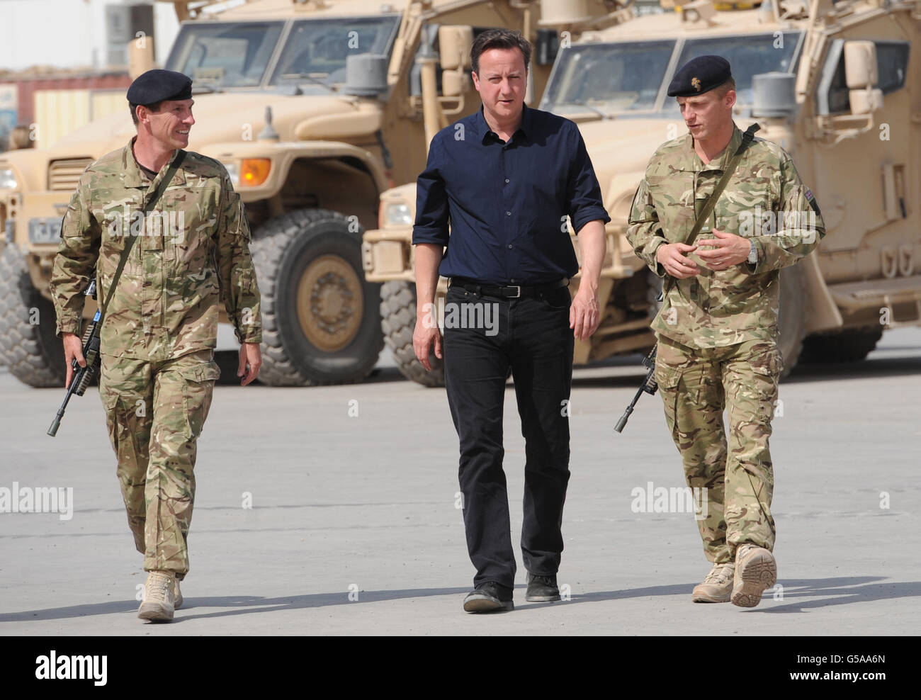 Prime Minister David Cameron is met by Major Toby Stratten Brown (right) at Camp Bastion in Afghanistan Helmand Province today. Stock Photo