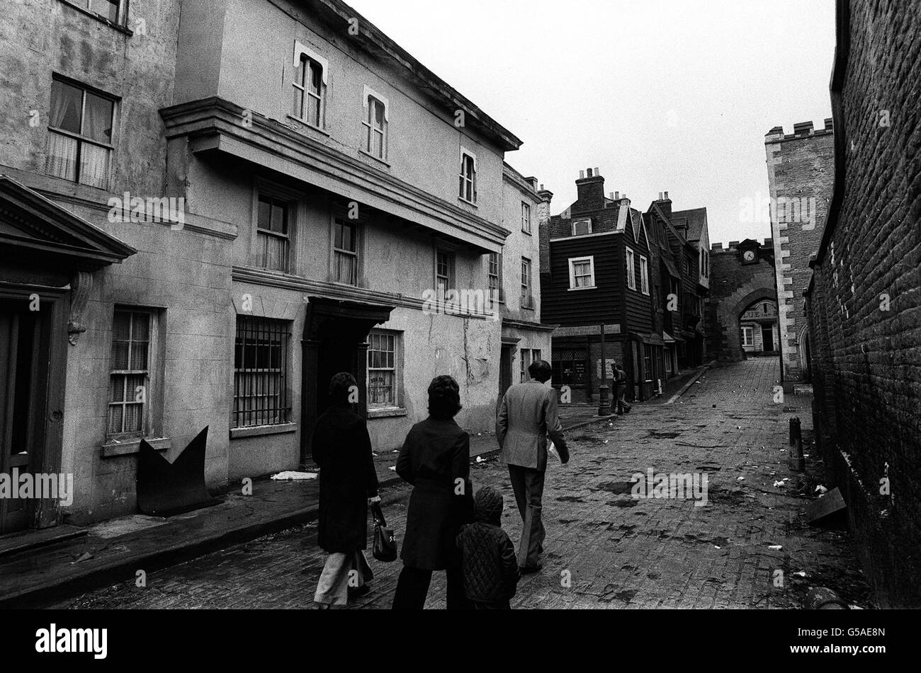 Visitors to Shepperton film studios, stroll along a mock-up of a street used in the musical film Oliver. *11/02/01 The film studio behind hits such as Blade Runner, Top Gun, Alien and Shakespeare in Love, has been sold to arch rival Pinewood Studios for 35 million, it emerged. The deal brings together two of the largest film and television studios in Europe and is set to create a global rival to Hollywood. It is being part-financed by venture capitalist 3i and led by Michael Grade, who heads the management team at Pinewood. Stock Photo