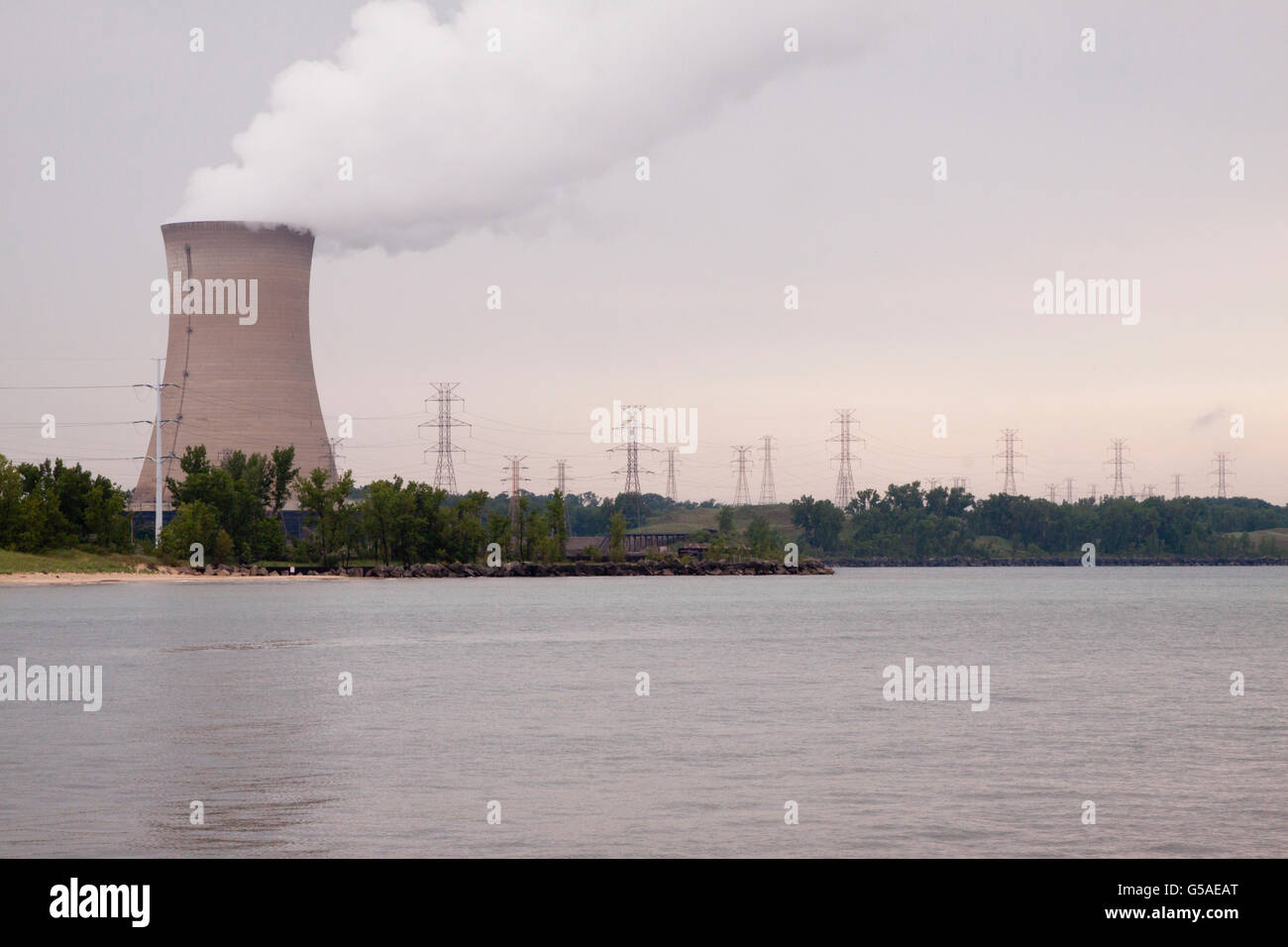 Smokestack of Nuclear Power Plant With Power Lines Stock Photo