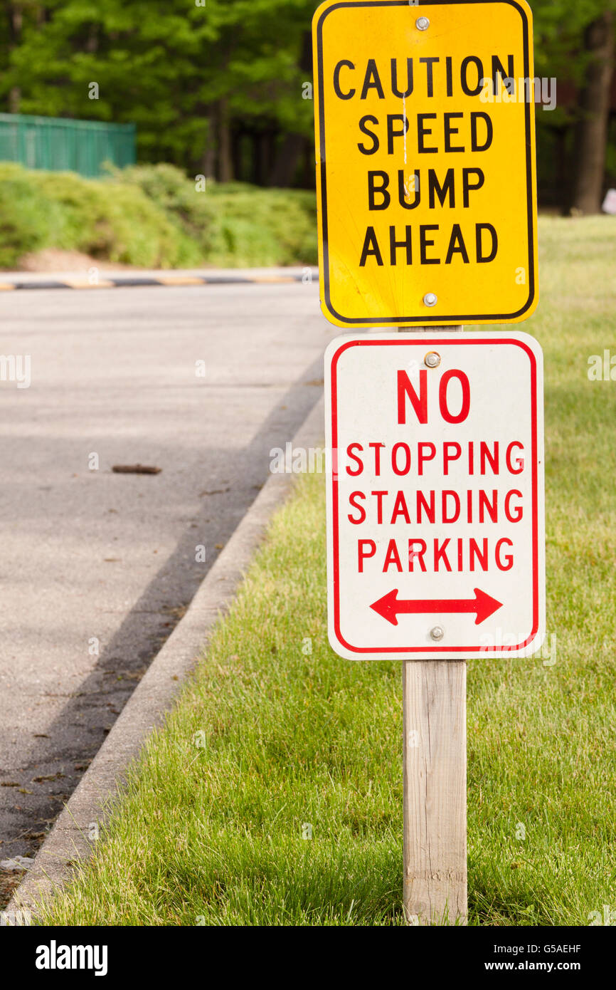 Speed Bump Ahead, No Stopping, No Standing, No Parking Sign Stock Photo