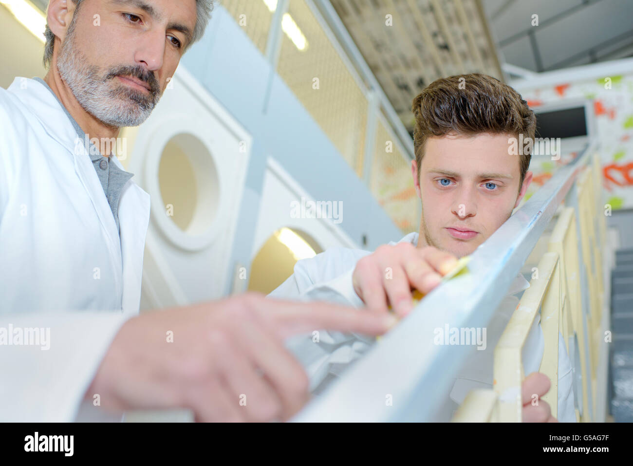 inspecting the railing Stock Photo - Alamy
