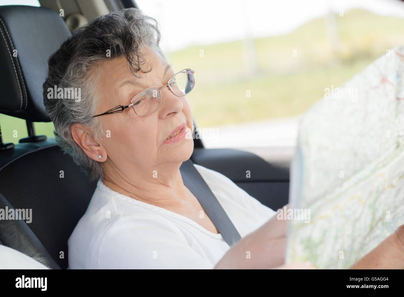 elderly woman with a map Stock Photo - Alamy