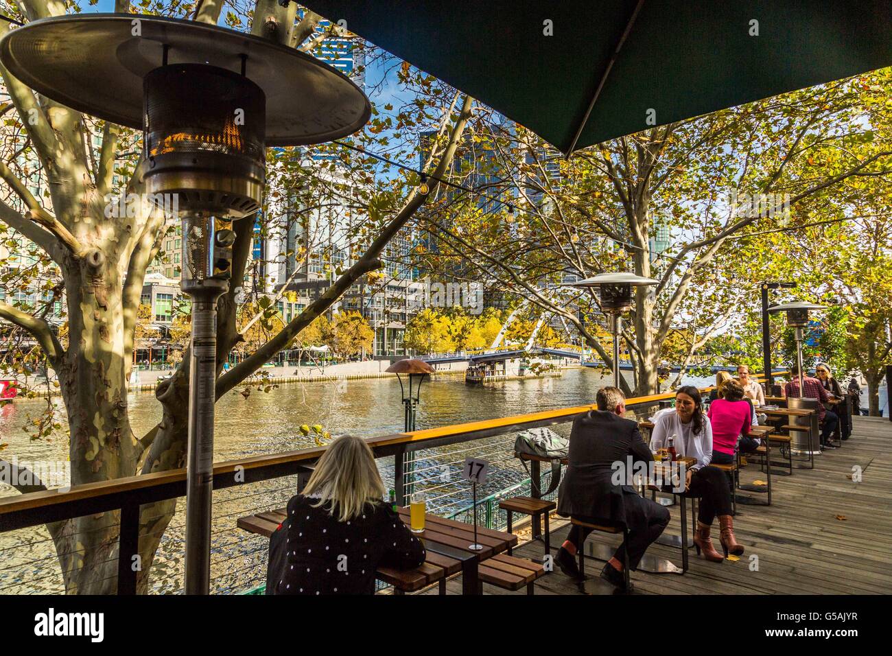 Views of boats, restaurants and shops along the Yarra River in Melbourne, Australia Stock Photo
