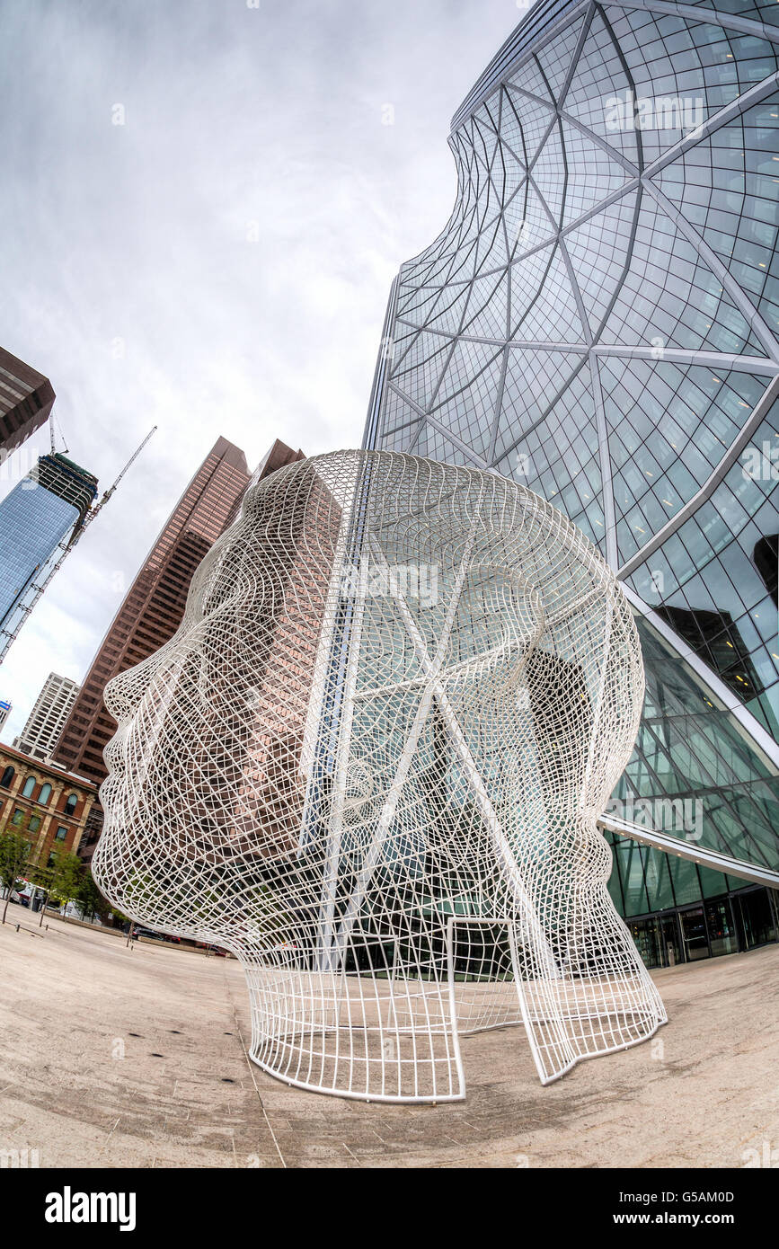 CALGARY, CANADA - June 14: Wonderland sculpture by Jaume Plensa in front of the Bow Tower in downtown Calgary. Stock Photo