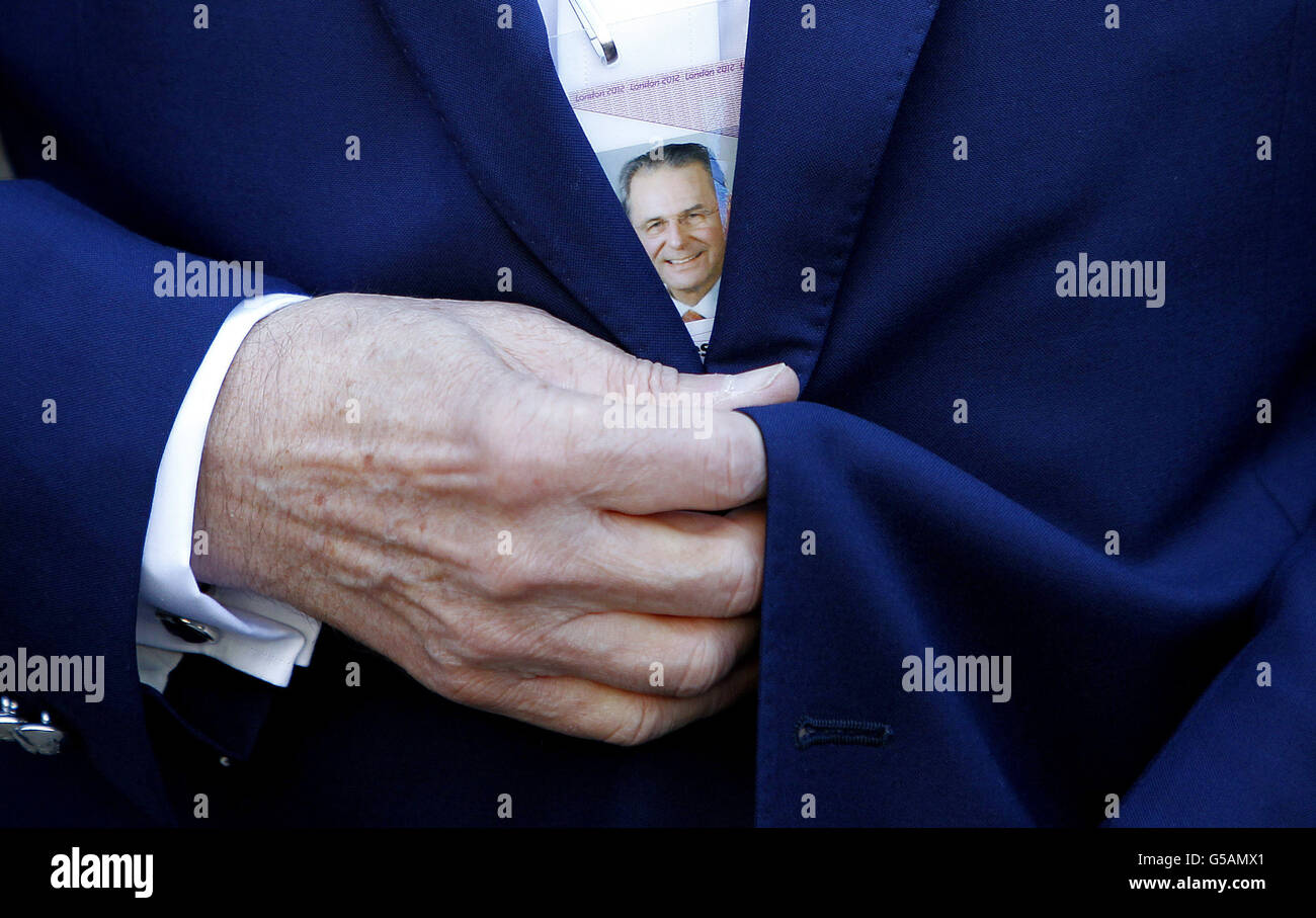 President of the International Olympic Committee, Dr Jacques Rogge's accreditation is seen through his jacket during a visit to the Olympic Village, before the official opening of the Village, in Stratford, east London. Stock Photo