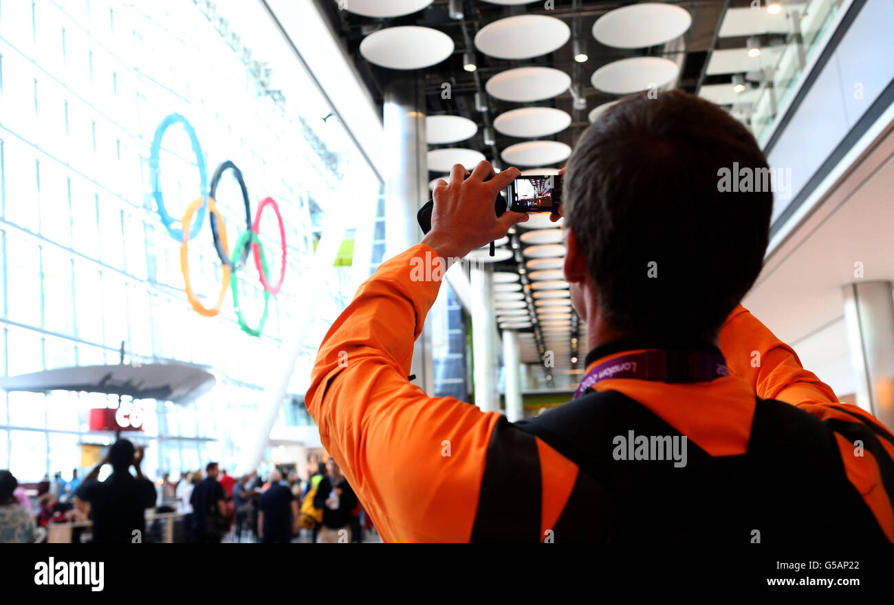 A members of the Netherlands Rowing team takes a picture of the Olympic