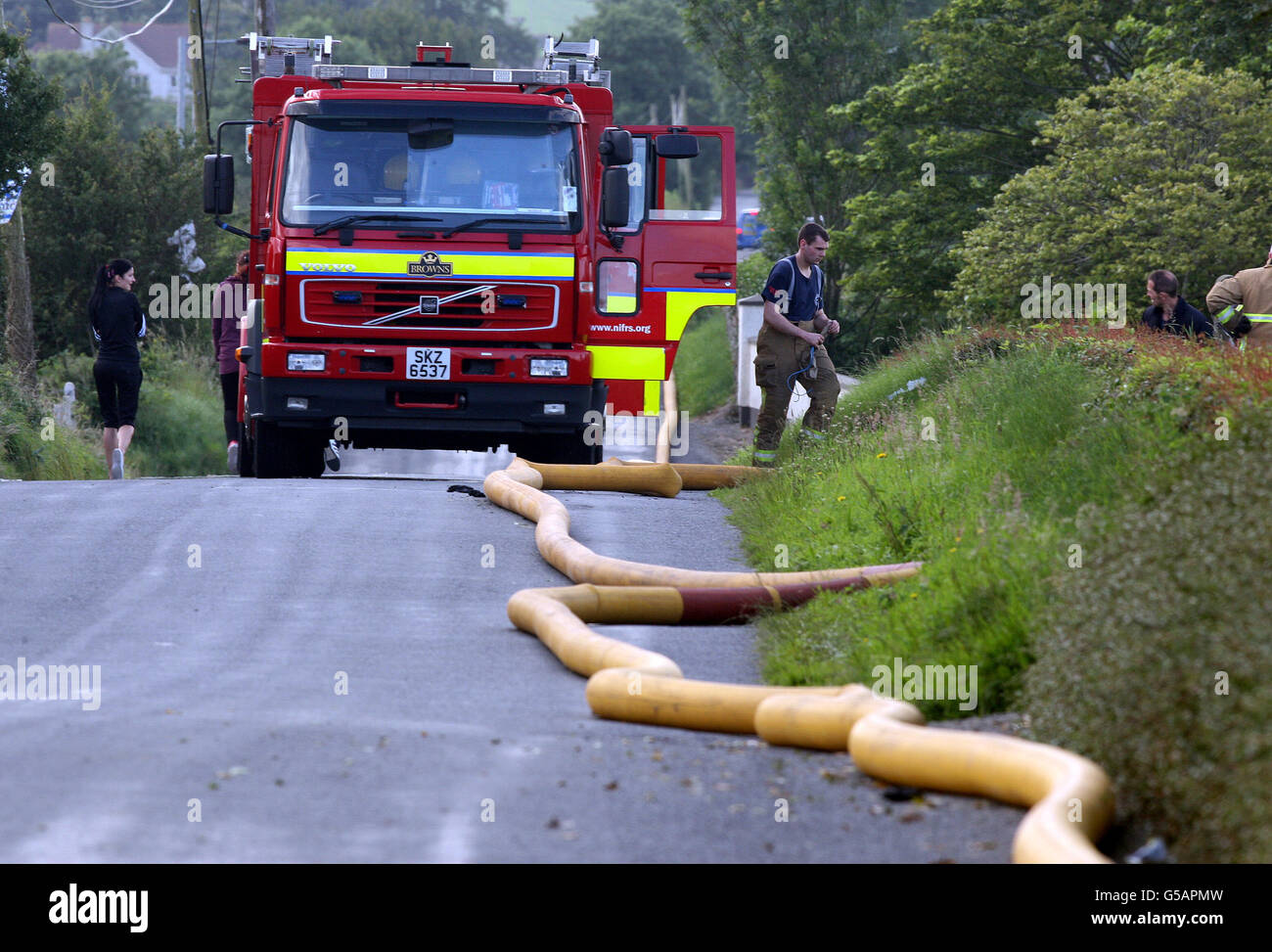 Firefighters at the scene near a huge blaze at a clothes recycling ...