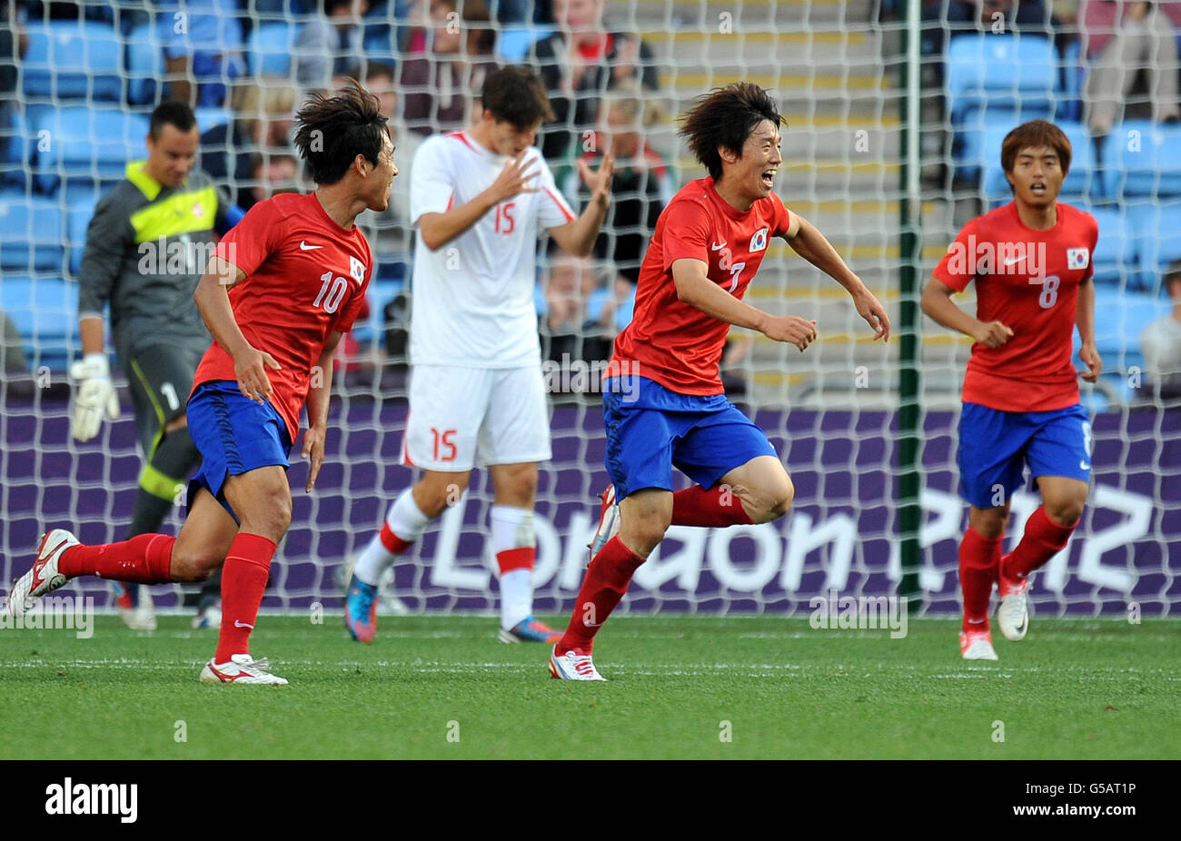 London Olympic Games - Day 2. South Korea's Bokyung Kim (centre) celebrates scoring during the Olympic Soccer match at the City of Coventry Stadium. Coventry. Stock Photo
