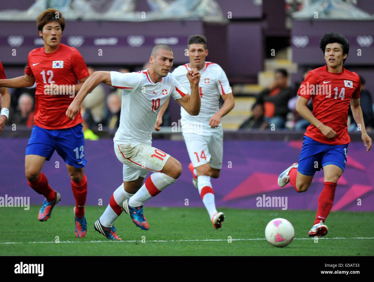 Switzerland's Pajtim Kasami bursts through the South Korea defence during the Olympic Soccer match at the City of Coventry Stadium. Coventry. Stock Photo