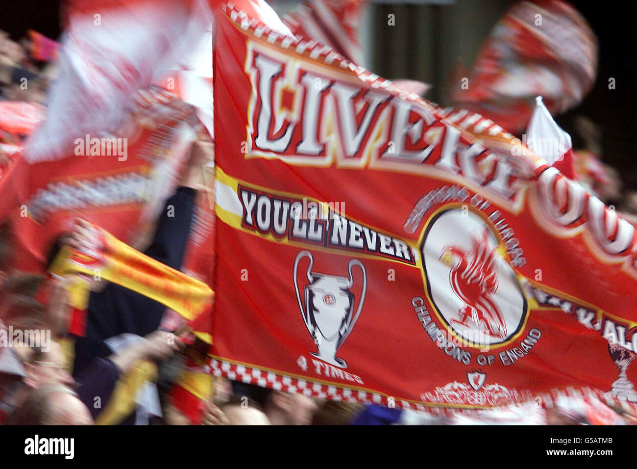 Liverpool fans wave flags hi-res stock photography and images - Alamy