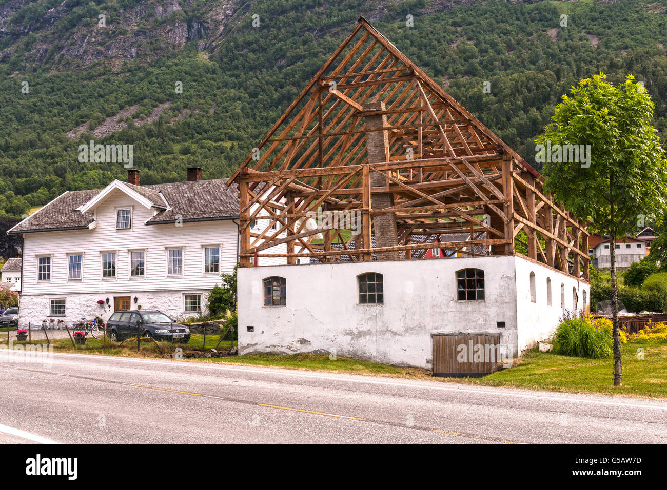 Norwegian farming. The wooden construction of a common barn, Olden, Norway. Droppings pit, cowshed and hay loft in one. Stock Photo