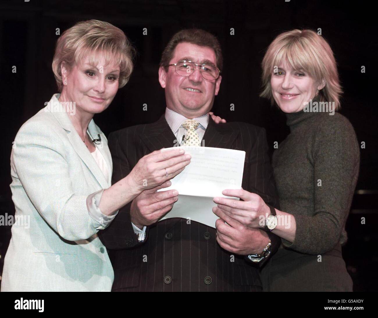 (L-R) TV presenter Angela Rippon, Berkshire farmer Alan Holland and Selina Scott reading from a script at rehearsals before a concert, Farm Aid, at the Royal Albert Hall, in London, in aid of farmers stricken by the effects of the foot-and-mouth crisis. * The concert is due to attended by the Prince of Wales and The Duke of Kent. Stock Photo