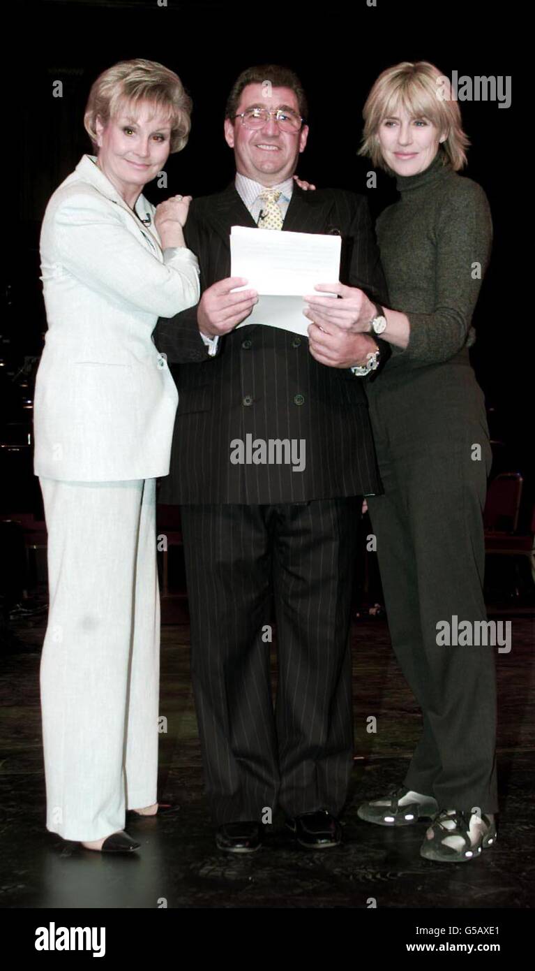(L-R) TV presenter Angela Rippon, Berkshire farmer Alan Holland and Selina Scott reading from a script at rehearsals before a concert, Farm Aid, at the Royal Albert Hall, in London, in aid of farmers stricken by the effects of the foot-and-mouth crisis. * The concert is due to attended by the Prince of Wales and The Duke of Kent. Stock Photo