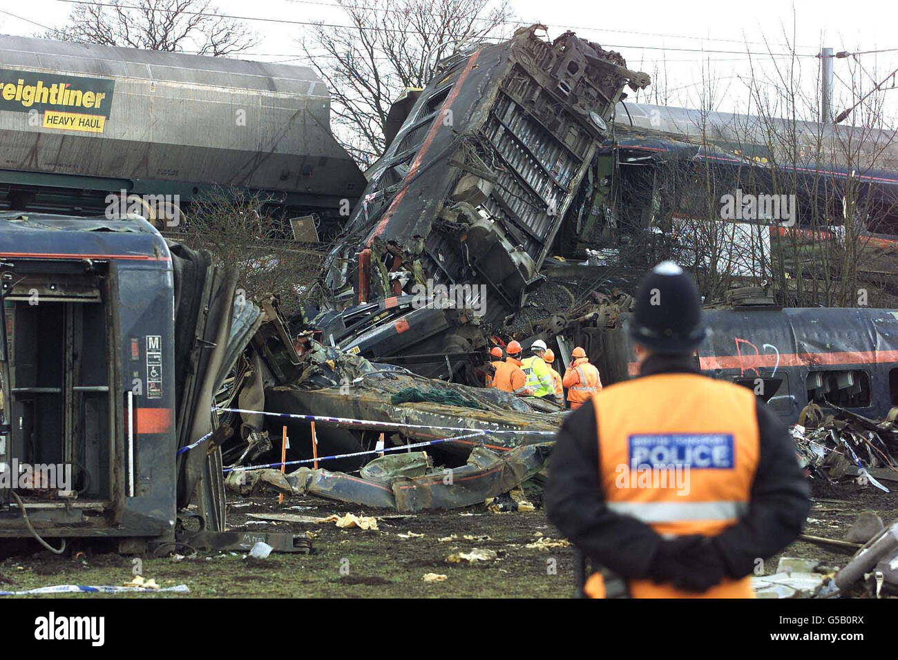 Emergency workers carry out a search and begin to remove personal belongings, at the scene at Great Heck, nr Selby, Yorkshire, where work is continuing following the railway crash in which 13 people are thought to have died. However, police have warned that more bodies may be recovered as the process of lifting the wrecked carriage begins. Stock Photo