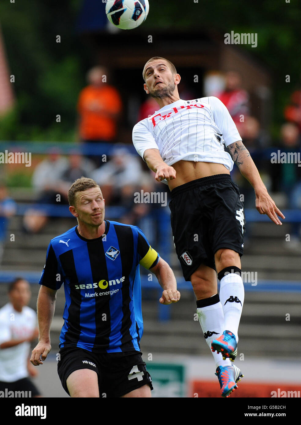 Fulham's Mladen Petric and HB Koge's Thomas Christensen battle for the ball Stock Photo